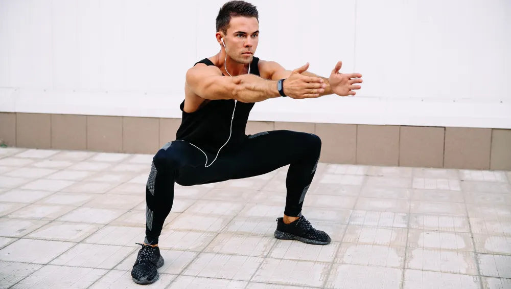 Homme en train de faire un exercice squat